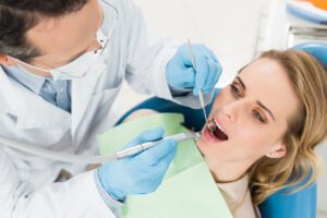 female patient at dental procedure using dental dr 4EXF62N scaled
