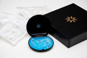 Invisalign aligners in a storage case. Invisible braces. Clear teeth straighteners. plastic bracers